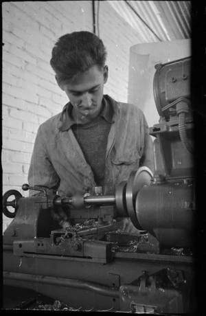 J E Ballantyne working at a lathe in the workshops at Maadi Camp, Egypt - Photograph taken by George Bull