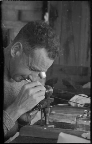 A D Bergman at work on watch and instrument repairs at Maadi Camp, Egypt - Photograph taken by George Bull