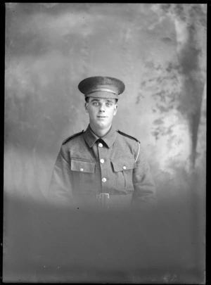 Studio upper torso portrait of unidentified soldier with hat, Christchurch