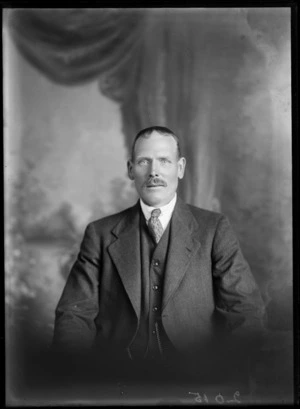 Studio upper torso portrait of an unidentified man with a moustache, jacket, waistcoat and a patterned tie, Christchurch
