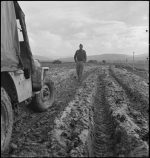 Muddy roads present new difficulties for NZ Divison on the Italian Front, World War II - Photograph taken by George Kaye