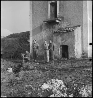 NZ soldiers mark place by house where enemy bomb landed and rolled away down a slope in Italy, World War II - Photograph taken by George Kaye