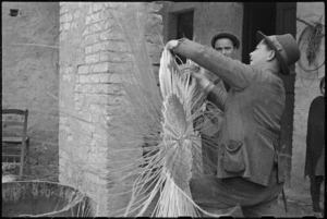 Italian villager at work basket making in forward area of Italian Front, World War II - Photograph taken by George Kaye