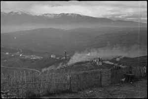 Smoke from exploding shells drifting across brickworks on the Orsogna Front, Italy, World War II - Photograph taken by George Kaye