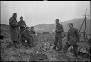 Group of New Zealand Artillery personnel in muddy conditions on the Italian Front, World War II - Photograph taken by George Kaye