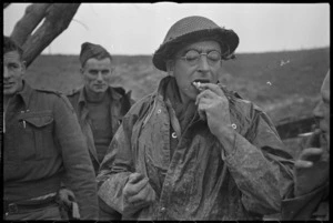 New Zealander Artillery soldier eating toast in forward areas of the Italian Front, World War II - Photograph taken by George Kaye