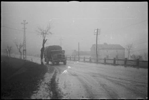 NZ Division vehicle making its way through the mud and mist on Christmas Eve on the Italian Front, World War II - Photograph taken by George Kaye