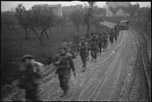 NZ Infantry formation making its way through mist and mud to the Italian Front Line, World War II - Photograph taken by George Kaye