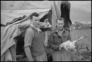 J Pierce and G A O'Loughlin prepare Christmas dinner in Italy, World War II - Photograph taken by George Kaye