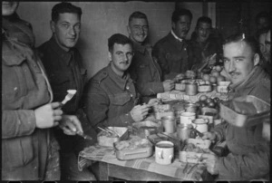 Members of a NZ Infantry Battalion enjoy Christmas dinner in a local Italian farmhouse, World War II - Photograph taken by George Kaye