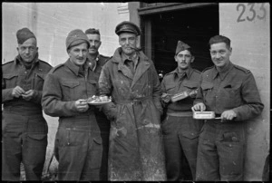 New Zealand personnel eating Christmas dinner in the NZ Sector of the Italian Front, World War II - Photograph taken by George Kaye