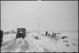 NZ transport making its way through snow on the Italian Front, World War II - Photograph taken by George Kaye
