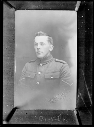 Head and shoulders studio portrait of unidentified soldier, in uniform - Photograph taken by Coronation Studio, 2 Victoria Street, Christchurch