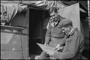 Captain J S Rutherford, Intelligence officer NZ Artillery, conferring with Captain A G Dick about reconnaissance flight, Italian Front, World War II - Photograph taken by George Kaye