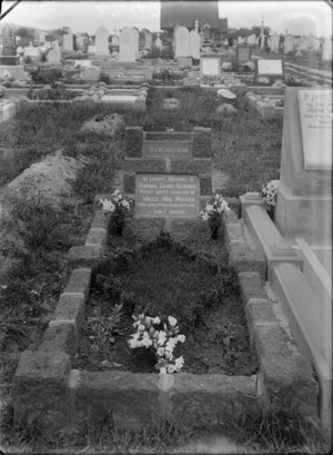 Outdoors grave plot with flowers and headstone of Corporal George Fredrick Webster who passed away 2nd of April 1922 aged 30, with other graves beyond, Sydenham Cemetery, Christchurch