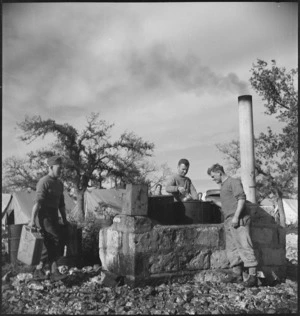 Preparing a meal in one of the newly constructed open air cookhouses, Italy, World War II - Photograph taken by M D Elias