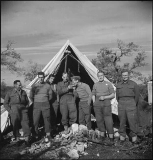 Men of 2 New Zealand Division outside their tent at the NZ Advance Base Camp in Italy, World War II - Photograph taken by M D Elias
