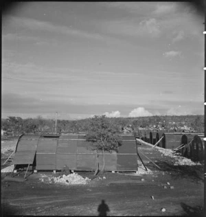 Newly built Nissen huts at New Zealand Advance Base Camp in Italy, World War II - Photograph taken by M D Elias