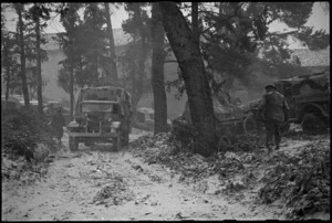 Truck of NZ Division makes its way through wooden country during a snowstorm on Italian Front, World War II - Photograph taken by George Kaye