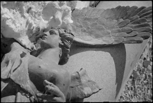 Sculptured angel lying in the snow in the forward areas of the Italian Front, World War II - Photograph taken by George Kaye