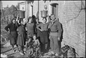 New Zealanders billetted in village behind Italian Front make friends with the household, World War II - Photograph taken by George Kaye