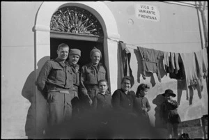 New Zealand Division personnel with the family of the house in which they are billetted in Italy, World War II - Photograph taken by George Kaye