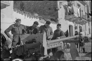 Members of New Zealand Artillery on gun maintenance during rest behind the lines, Italy, World War II - Photograph taken by George Kaye