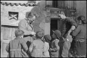 Men of 2 New Zealand Division fraternizing with children in Italian village, Italy, World War II - Photograph taken by George Kaye