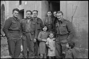Group in a village behind the Italian Front where members of 2 NZ Division are resting, World War II - Photograph taken by George Kaye