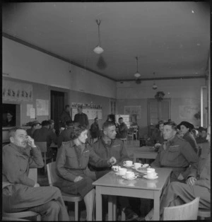Lady Freyberg talking to senior NZ officers in the Officers Lounge of the NZ Forces Club in Bari, Italy, World War II - Photograph taken by M D Elias