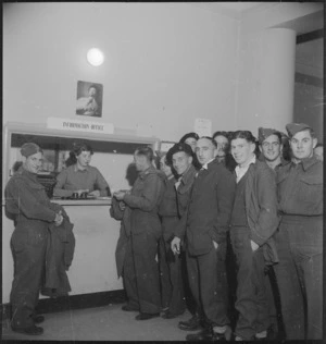 Group of New Zealanders at the information desk at the NZ Forces Club in Bari, Italy, World War II - Photograph taken by M D Elias