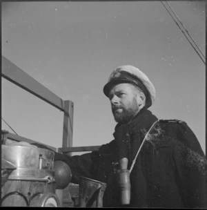 Lieutenant H L Mallitte in command of one of the motor mine sweepers used in the Mediterranean, World War II - Photograph taken by M D Elias