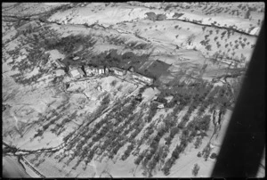 Aerial view of a cluster of farmhouses in the Sangro River area, Italy, World War II - Photograph taken by George Kaye