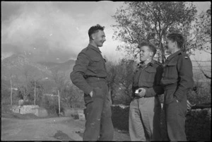 Three New Zealanders chat on the roadside in the Volturno Valley, Italy, World War II - Photograph taken by George Kaye