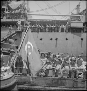 Newly arrived NZ reinforcements transfer from ship to shore by lighter, Port Tewfik, World War II - Photograph taken by S Wemyss