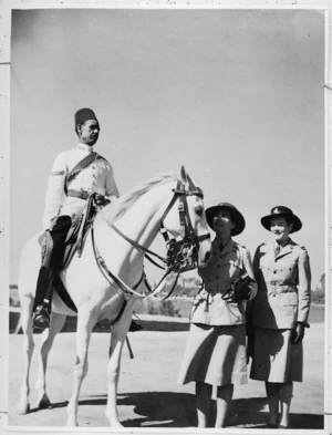 NZ WAACs admire an Egyptian mounted policeman, Cairo, World War II