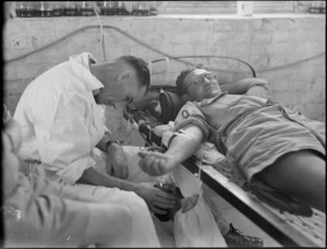 Drawing off blood from blood donors at Maadi Camp Hospital, World War II - Photograph taken by G Bull