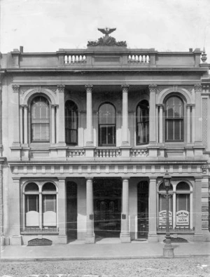Building in Wellington, with a sign advertising the business of W C McNee