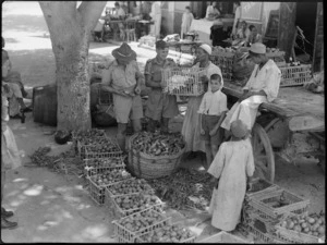 Two NZ soldiers buying vegetables and fruit in Cairo for the officers' and sergeants' messes in Cairo during World War II - Photograph taken by George Kaye