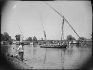 Nile River scene showing laden boats and men fishing, Egypt - Photograph taken by George Kaye