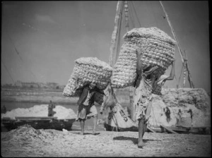 Unloading chaff from native boats, Egypt - Photograph taken by George Kaye