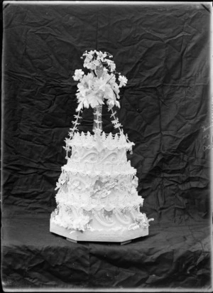 Three layered wedding cake, with flower decorations