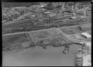 Vehicular ferry in port with cars and trucks on board, Mechanics Bay, Auckland, showing Auckland railyards in the background