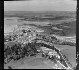 Portland Cement Works, Northland, on the inner Whangarei Harbour with residential village and railway mid-view and primary school foreground, looking south to farmland beyond