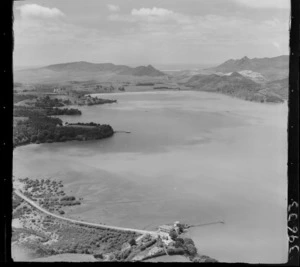 Parua Bay, Whangarei Harbour, Northland, with Parua Bay Tavern foreground with jetty and Whangarei heads Road