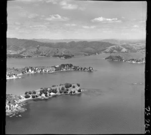 Omakiwi Cove and Kokinga Point with a residential house (mid-view), Parekura and Waipiro Bays beyond with the Yates headland bush covered property in between, Bay of Islands, Northland