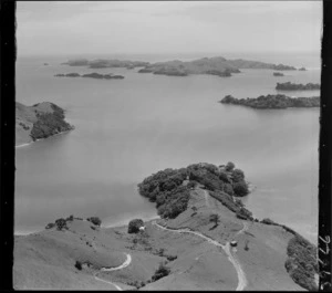 The Yates property on a bushed headland between Waipiro Bay and Te Uenga Bay, looking north to Urupukapuka Island beyond, Bay of Islands, Northland