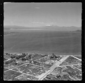 Taupo, includes view of lake, roads, housing and Mount Ruapehu