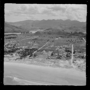 Whangamata Beach with houses and baches, with the Otahu River beyond, Whangamata, Thames-Coromandel District