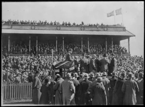 Kingsford Smith, and crowd, Christchurch, after his successful flight over the Tasman Sea from Australia to New Zealand - Photograph taken by Robson and Boyer